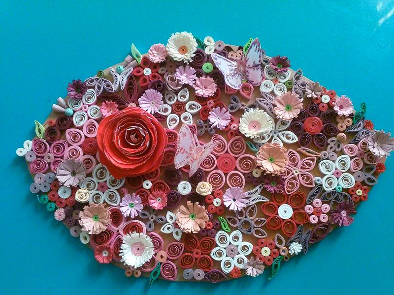 some colorful flower made by Paper Quilling crafting