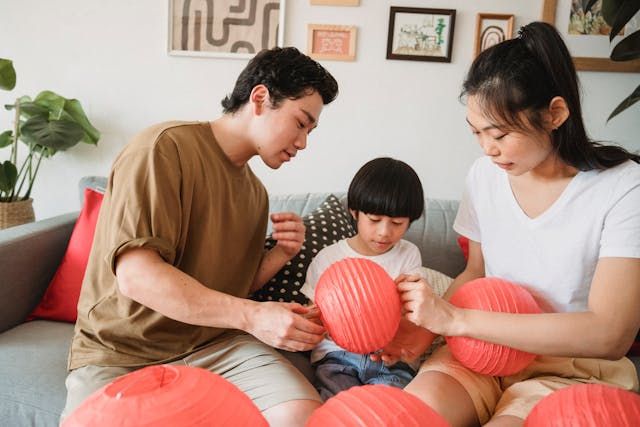 A family making light by crafting art